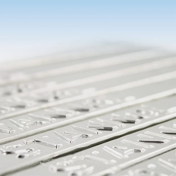 The picture shows several Stannol solder bars lined up in a row. 