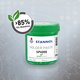 The image shows a green plastic container of solder paste from the brand Stannol. The label reads “Solder Paste SP6000” along with the “green connect” logo, symbolized by a green leaf. To the left above the container, there is a circular icon with a leaf and the text “85% CO₂ reduction.” The background is gray with schematic lines and dots, creating a technical, modern look. The image highlights Stannol’s sustainability efforts, specifically the 85% CO₂ reduction for this product.