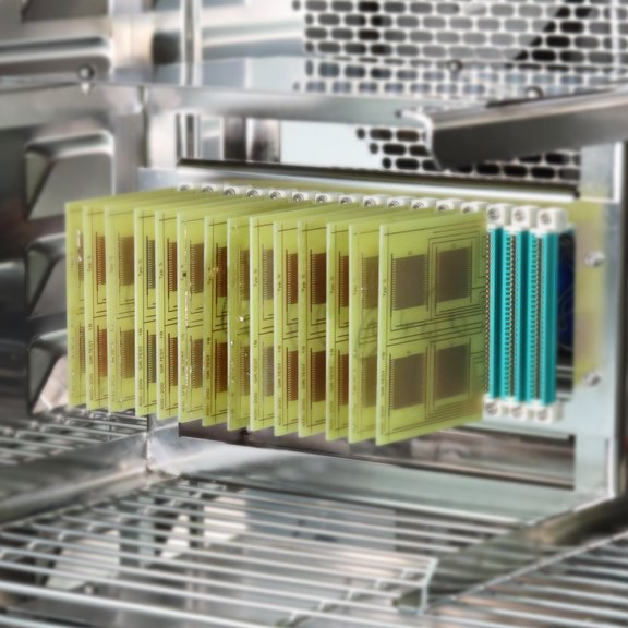 The picture shows a climate chamber with a test rack.