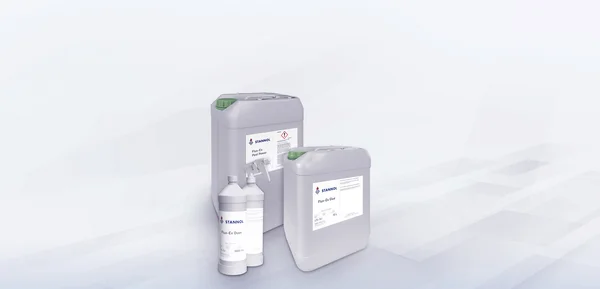 The picture shows part of the Stannol cleaner range: Two light grey canisters with a green lid and white label, one with the words Flux-Ex Post Power and Flux-Ex Glue and the Stannol logo. In front of them are two light grey spray bottles with a white label and the words Flux-Ex Oven and the Stannol logo.