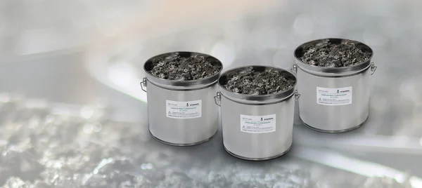 The picture shows three metal containers with solder dross.