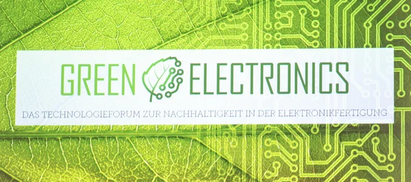 Das Bild zeigt eine Leinwand mit dem grün-weißen Schriftzug Green Electronics.