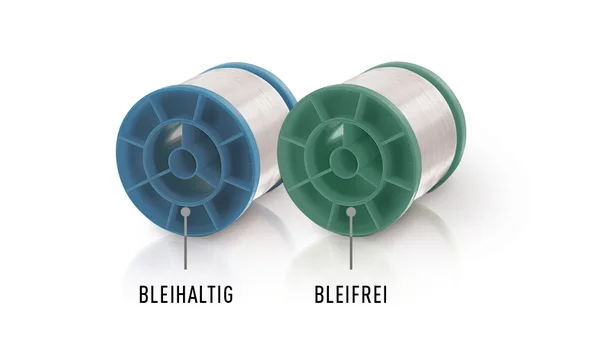 Auf dem Bild sind zwei Lötdraht-Spulen von Stannol zu sehen, eine grüne und eine blaue. Blau steht für bleihaltigen Lötdraht, Grün für bleifreien.