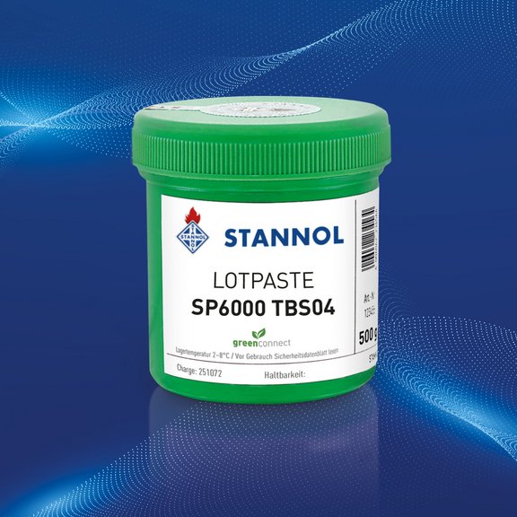 The picture shows a green Stannol solder paste tin against a blue background. The white label shows the Stannol logo, the product name SP6000 TBS04 and other product specifications.