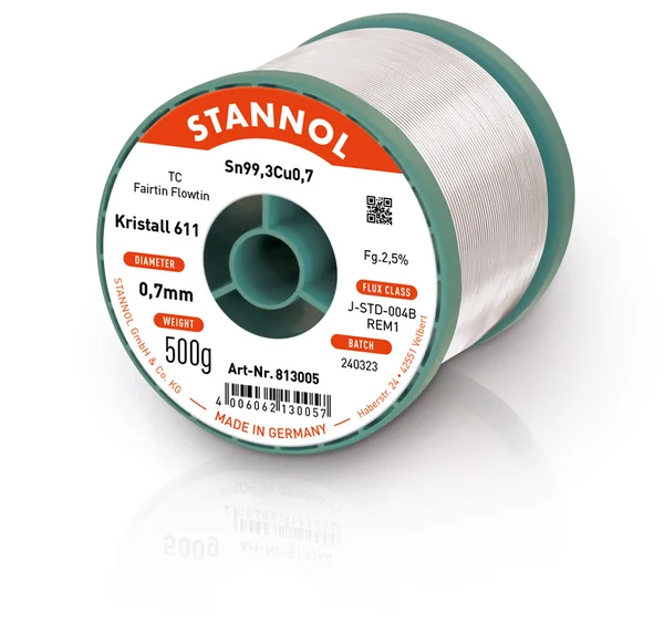 The picture shows a horizontal reel of Kristall 611 solder wire. The label on the front is orange and white and bears various product specifications and the Stannol logo.